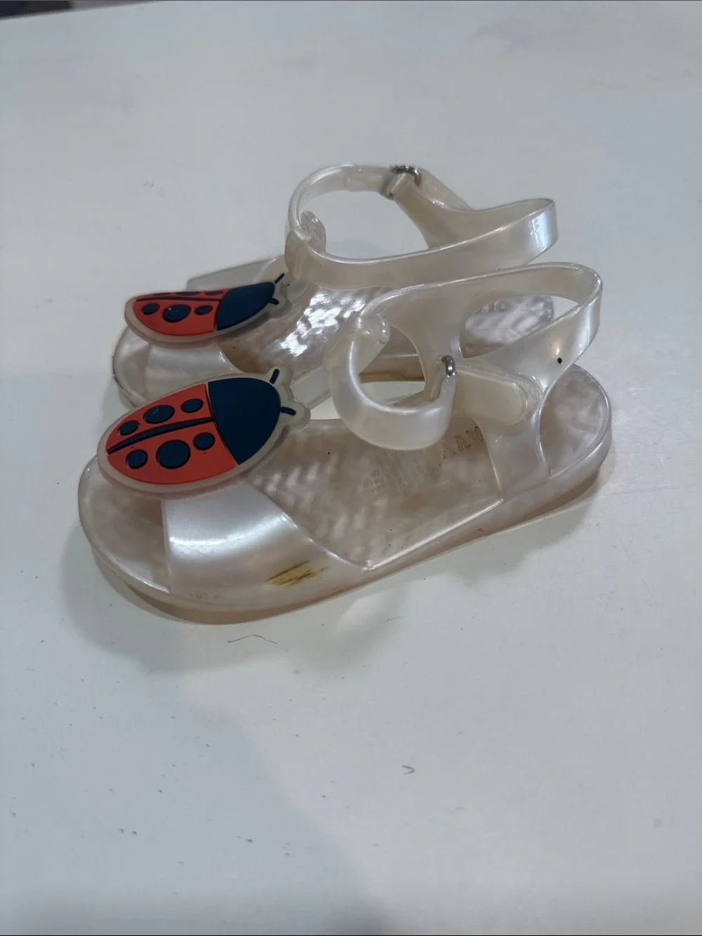 Clear Kids Jelly Sandals with Red Ladybug Accent